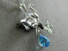 ESTATE .77CT DIAMOND & BLUE TOPAZ 14KT WHITE & BLACK GOLD PANTHER FLOWER PENDANT