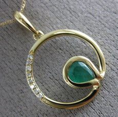 ESTATE .03CT DIAMOND & AAA EMERALD 14KT YELLOW GOLD CIRCLE OF LIFE FUN PENDANT