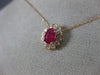 ESTATE .71CT DIAMOND & AAA OVAL CUT RUBY 14KT ROSE GOLD FLOWER FLOATING PENDANT