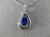 ESTATE .63CT DIAMOND & AAA TANZANITE 14KT WHITE GOLD OVAL INFINITY LOVE PENDANT