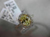 ESTATE 1.32CT GIA FANCY YELLOW DIAMOND 18KT WHITE GOLD OVAL HALO ENGAGEMENT RING