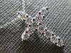 ESTATE .64CT DIAMOND 14KT WHITE GOLD SHARED PRONG INVISIBLE CROSS PENDANT #27677