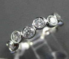 ESTATE .75CT ROUND DIAMOND 14KT WHITE GOLD WAVE BEZEL ETOILE ANNIVERSARY RING