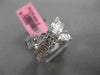 ESTATE 1.12CT ROUND & BAGUETTE DIAMOND 18KT WHITE GOLD CRISS CROSS INFINITY RING