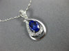 ESTATE .63CT DIAMOND & AAA TANZANITE 14KT WHITE GOLD OVAL INFINITY LOVE PENDANT
