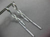 ESTATE LONG .28CT DIAMOND 14KT WHITE GOLD INFINITY LOVE HUGGIE HANGING EARRINGS