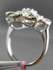 ESTATE LARGE .78CT ROUND & BAGUETTE DIAMOND 18KT WHITE GOLD FLOWER COCKTAIL RING