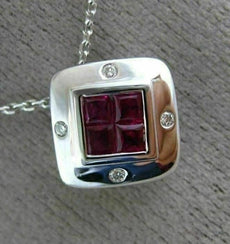 ESTATE .80CT DIAMOND & AAA RUBY 18KT WHITE GOLD SQUARE ETOILE INVISIBLE PENDANT