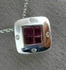 ESTATE .80CT DIAMOND & AAA RUBY 18KT WHITE GOLD SQUARE ETOILE INVISIBLE PENDANT