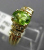 ESTATE 1.08CT ROUND DIAMOND & AAA OVAL PERIDOT 14KT YELLOW GOLD ENGAGEMENT RING