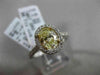 ESTATE 1.32CT GIA FANCY YELLOW DIAMOND 18KT WHITE GOLD OVAL HALO ENGAGEMENT RING