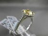 ESTATE 1.32CT GIA FANCY YELLOW DIAMOND 18KT WHITE GOLD OVAL HALO ENGAGEMENT RING