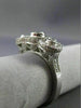 ESTATE .92CT DIAMOND 18KT WHITE GOLD 3 STONE PAST PRESENT FUTURE HALO BEZEL RING