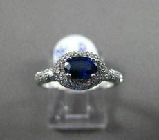 ESTATE 1.03CT DIAMOND & AAA SAPPHIRE 18KT WHITE GOLD HALO DESIGN ENGAGEMENT RING