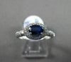 ESTATE 1.03CT DIAMOND & AAA SAPPHIRE 18KT WHITE GOLD HALO DESIGN ENGAGEMENT RING