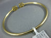 .79CT DIAMOND 18KT YELLOW GOLD ROUND & BAGUETTE CLUSTER FLEXIBLE BANGLE BRACELET