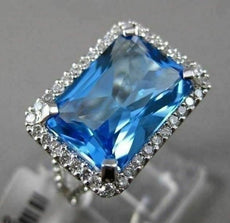 ESTATE 11.42CTW DIAMOND & AAA EMERALD CUT BLUE TOPAZ 14KT WHITE GOLD HALO RING