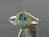 ESTATE .48CT DIAMOND & AAA OVAL CUT AQUAMARINE 14KT WHITE GOLD 3D LOVE KNOT RING