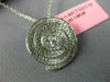 ESTATE .83CT DIAMONDS 18KT WHITE GOLD CIRCULAR MULTI ROW SWIRL SOLITAIRE PENDANT
