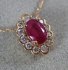 ESTATE .71CT DIAMOND & AAA OVAL CUT RUBY 14KT ROSE GOLD FLOWER FLOATING PENDANT