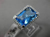 ESTATE 11.42CTW DIAMOND & AAA EMERALD CUT BLUE TOPAZ 14KT WHITE GOLD HALO RING