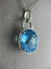ESTATE LARGE 6.60CT DIAMOND & BLUE TOPAZ 14KT WHITE GOLD HALO ROUND HALO PENDANT