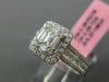ESTATE LARGE .66CT ROUND & BAGUETTE DIAMOND 18KT WHITE GOLD HALO ENGAGEMENT RING