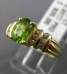 ESTATE 1.08CT ROUND DIAMOND & AAA OVAL PERIDOT 14KT YELLOW GOLD ENGAGEMENT RING
