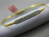 ESTATE .15CT DIAMOND 14KT TWO TONE GOLD ELONGATED PAVE FLEXIBLE BANGLE BRACELET