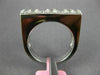 ESTATE .60CT DIAMOND 18KT WHITE GOLD ROUND & PRINCESS INVISIBLE ANNIVERSARY RING