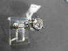 ESTATE 1.12CT ROUND & BAGUETTE DIAMOND 14KT WHITE GOLD SOLITAIRE ENGAGEMENT RING