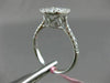 ESTATE LARGE .69CT ROUND & BAGUETTE DIAMOND 18KT WHITE GOLD OVAL ENGAGMENT RING