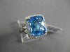 ESTATE 6.43CTW DIAMOND & AAA EXTRA FACET BLUE TOPAZ 14KT WHITE GOLD HALO RING