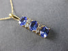 ESTATE 1.06CT DIAMOND & AAA TANZANITE 14KT YELLOW GOLD 3 STONE JOURNEY PENDANT