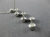 ESTATE .25CT DIAMOND 14KT WHITE GOLD CLASSIC ROUND BEZEL ZIG ZAG JOURNEY PENDANT