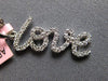 ESTATE .16CT DIAMOND 14KT WHITE GOLD 3D SCRIPT LOVE FLOATING PENDANT