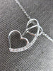 ESTATE .03CT DIAMOND 14KT WHITE GOLD 3D DOUBLE HEART LOVE FLOATING PENDANT
