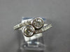 ESTATE .68CT DIAMOND 14KT WHITE GOLD CLASSIC BEZEL 2 STONE CRISS CROSS LOVE RING