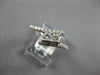 .63CT DIAMOND 14KT WHITE GOLD 3D PRINCESS & ROUND 2 STONE CRISS CROSS LOVE RING