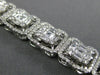LARGE 7.05CT ROUND & BAGUETTE DIAMOND 18KT WHITE GOLD 3D CLUSTER TENNIS BRACELET
