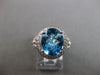 3.53CT DIAMOND & AAA BLUE TOPAZ 14KT WHITE GOLD OVAL & ROUND HALO LOVE KNOT RING