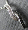ESTATE .04CT WHITE AND BLACK DIAMOND 14K WHITE GOLD 3D INFINITY FLOATING PENDANT