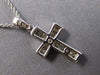 ESTATE SMALL .22CT DIAMOND 14KT WHITE GOLD ROUND CHANNEL CROSS FLOATING PENDANT