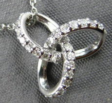 ESTATE .13CT DIAMOND 14KT WHITE GOLD 3D LOVE KNOT STAR FLOWER FLOATING PENDANT