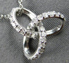 ESTATE .13CT DIAMOND 14KT WHITE GOLD 3D LOVE KNOT STAR FLOWER FLOATING PENDANT