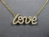 ESTATE .16CT DIAMOND 18KT YELLOW GOLD 3D CLASSIC SCRIPT LOVE NECKLACE