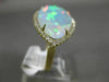 ESTATE EXTRA LARGE 8.13CT DIAMOND & AAA OPAL 14KT YELLOW GOLD CLASSIC HALO RING