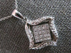 .52CT DIAMOND 18KT WHITE GOLD ROUND & PRINCESS INVISIBLE SQUARE FLOATING PENDANT