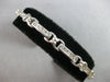 ESTATE LONG 2.60CT DIAMOND 14KT WHITE GOLD ROUND CHANNEL X LOVE TENNIS BRACELET