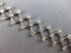 ESTATE .52CT DIAMOND 14K WHITE GOLD BEZEL ETOILE CRISS CROSS FUN TENNIS BRACELET